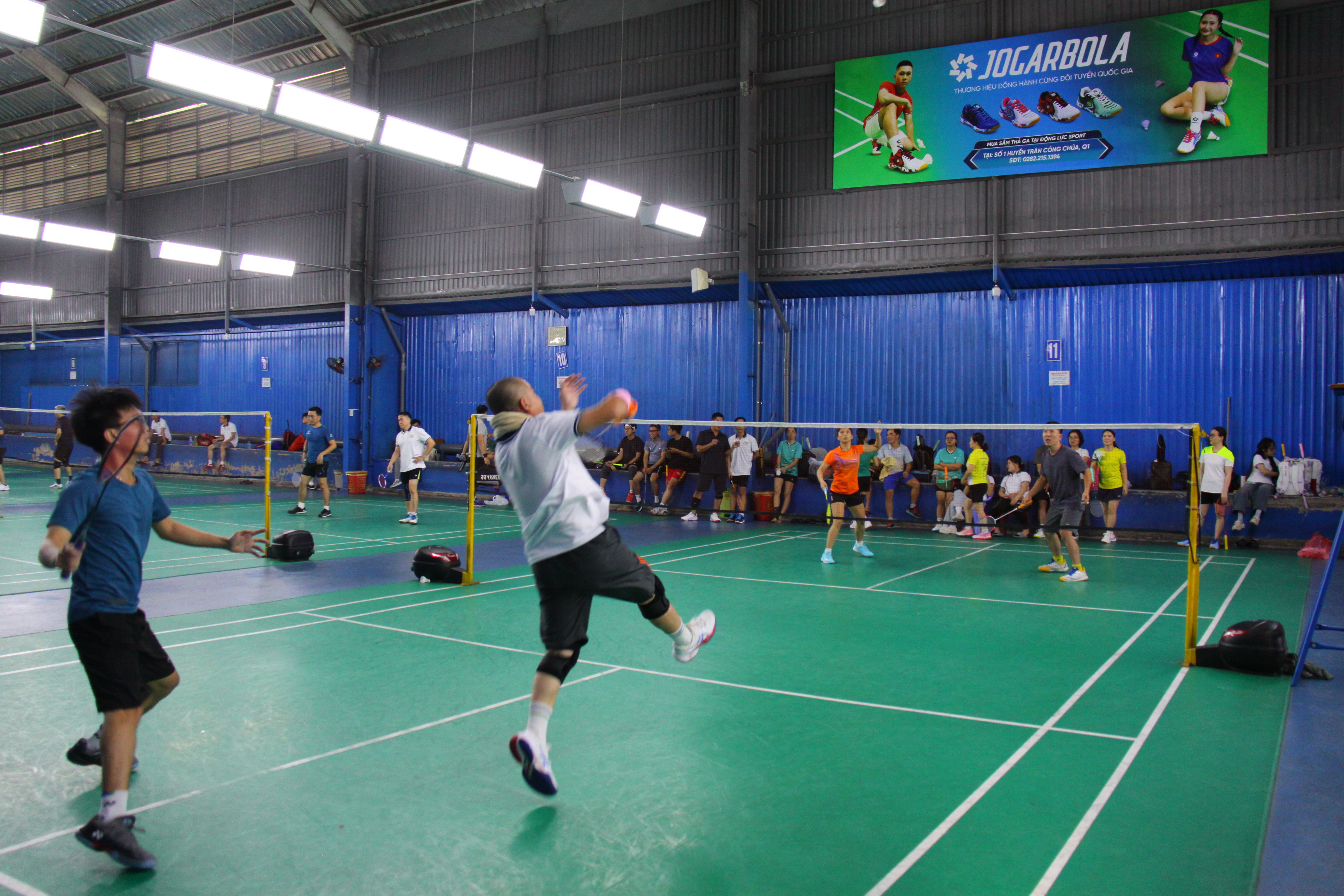 A person jumping in the air to hit a ballAI-generated content may be incorrect.