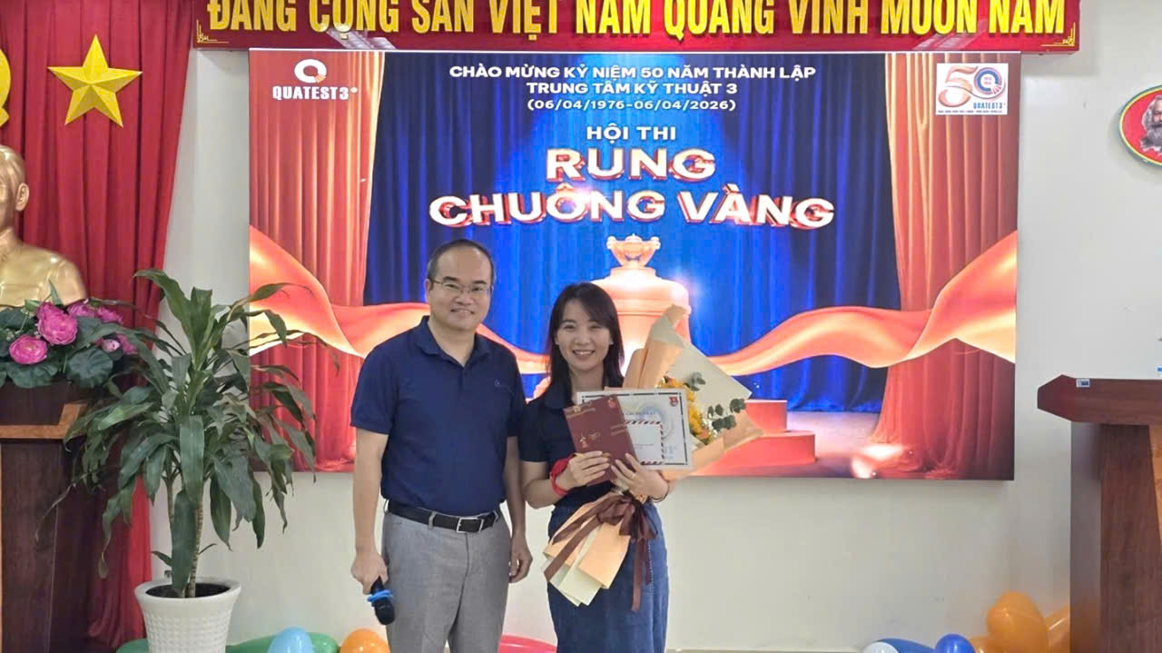 A person and person standing in front of a large bannerAI-generated content may be incorrect.