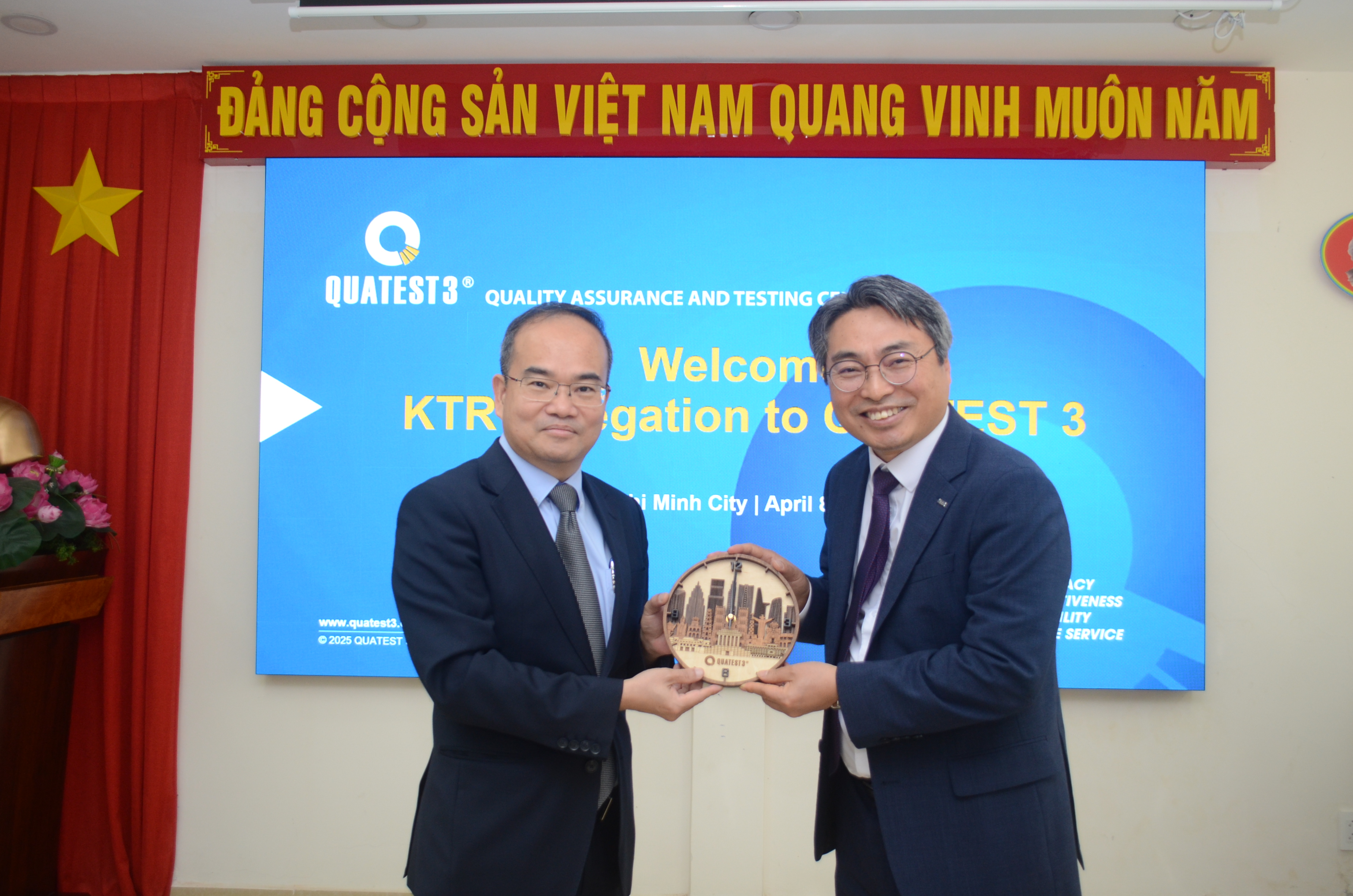 Two men in suits holding a trophyAI-generated content may be incorrect.