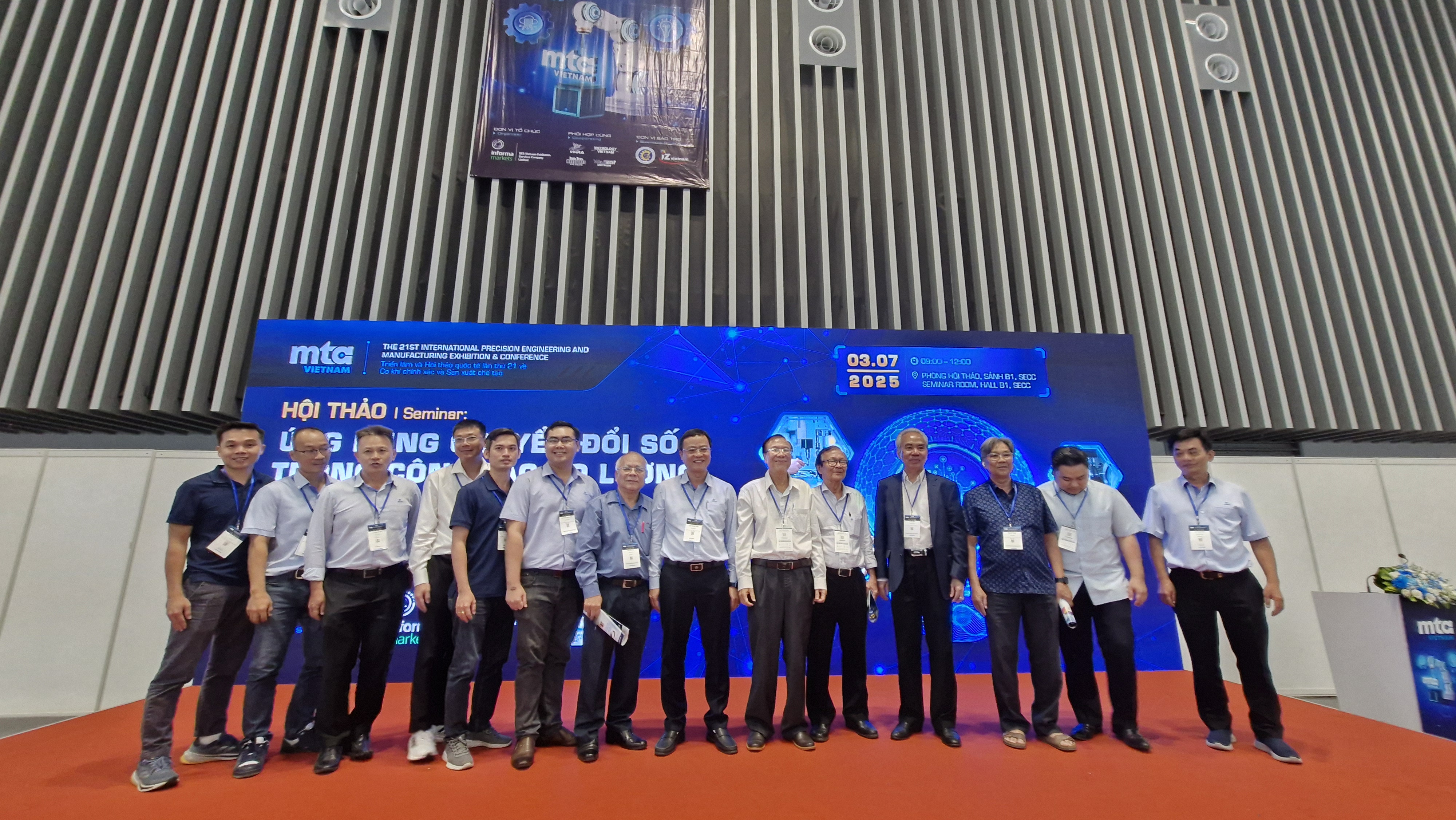 A group of people standing in front of a large screenAI-generated content may be incorrect.